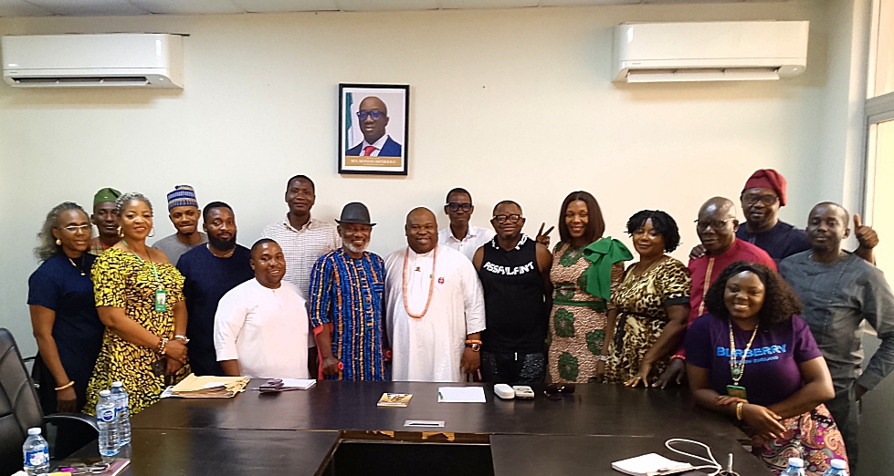 Edo Commissioner Chris Okaeben and the filmmakers who visited him